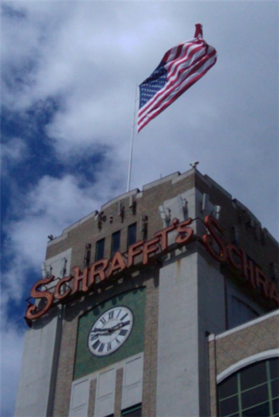 Old Glory flying proudly on top of the Schraffs tower over looking Charlestown, MA.