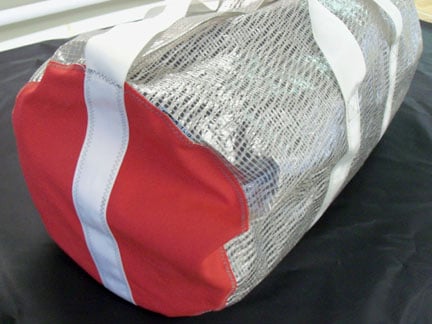Tote bag made from recycled kevlar sailing material.