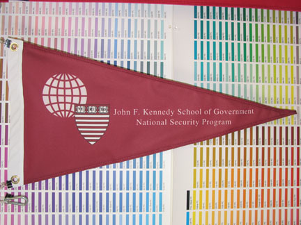 This printed pennant for Harvards JFK School of Government was taken aboard a shuttle mission to space!