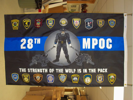 Another custom flag incorporating applique, print and embroidered patches for the M.B.T.A. Police Academy that is the very definition of a hybrid flag.